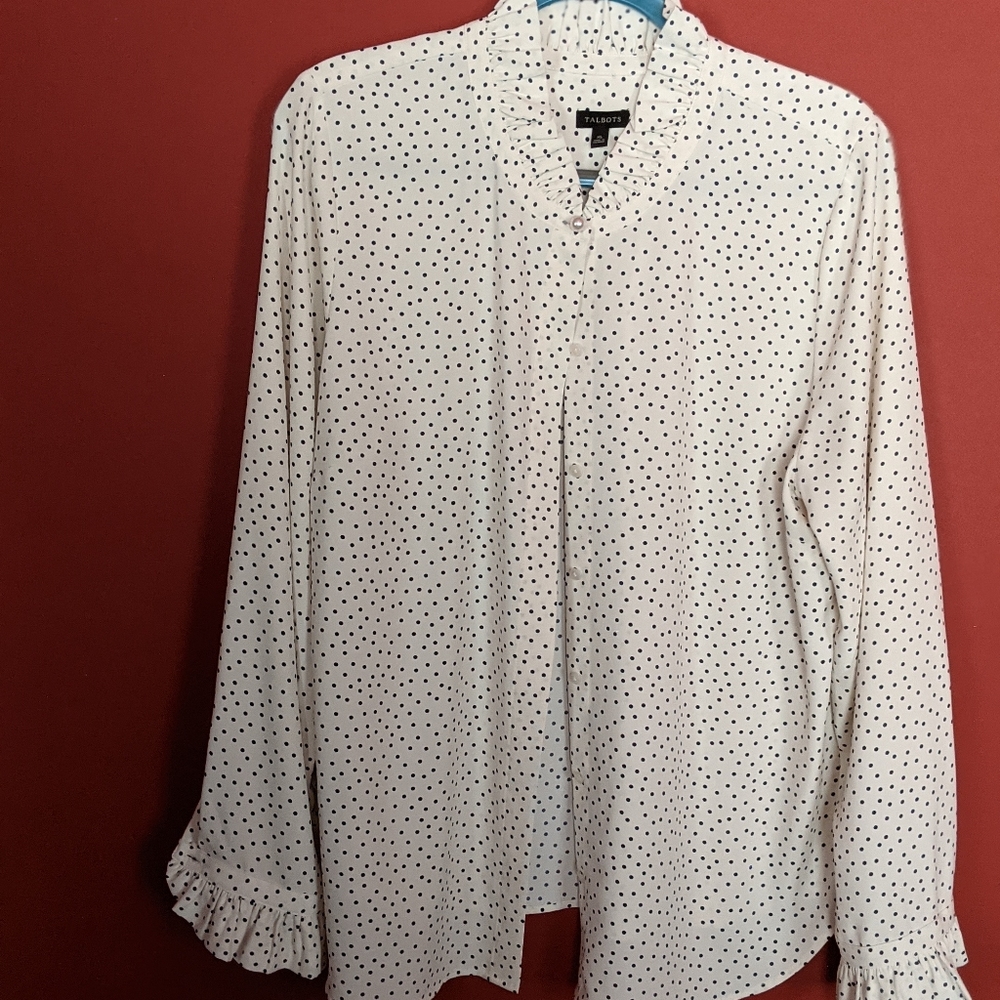 Long sleeved blouse, cream with Navy dots and ruffles at neck and cuffs